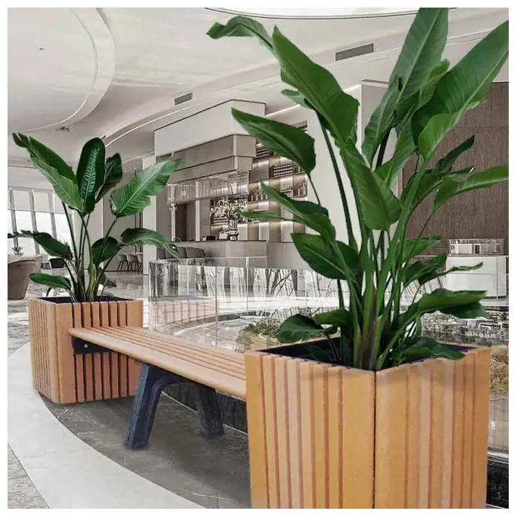 Commercial bench with integrated planters and tall greenery creating functional seating in an indoor public space